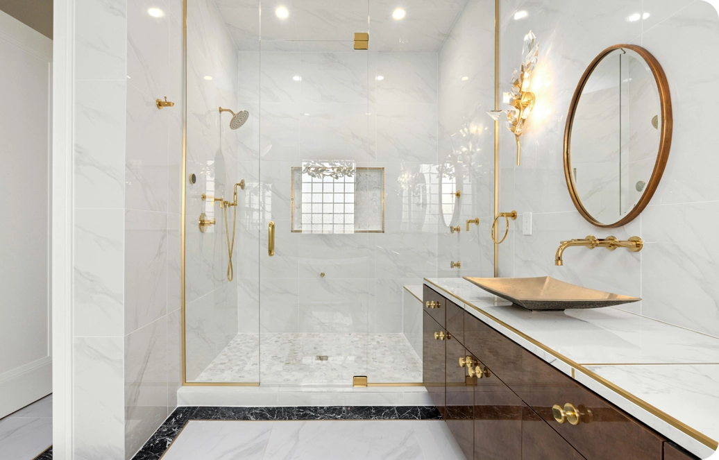 A bathroom with a large walk in shower and a sink.