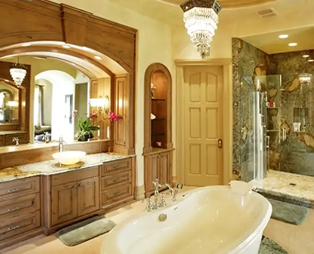 A bathroom with a large tub and walk in shower.